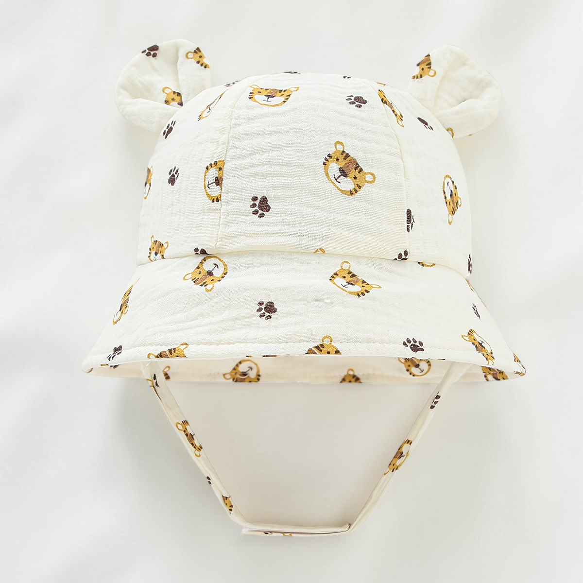 Chapeau de soleil Le Cocon d'Or pour bébé en coton blanc avec motif tigre et oreilles d'ours, style bob respirant.