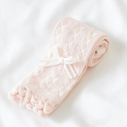 Collant Le Cocon d'Or pour fille en maille rose pâle avec motif texturé et petit nœud décoratif