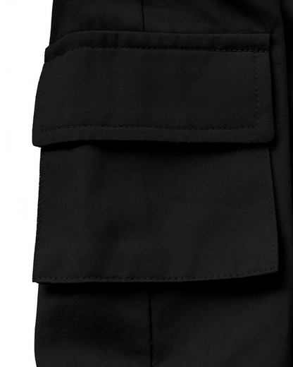 Gros plan sur la poche latérale d'un pantalon noir en coton Le Cocon d'Or pour petite fille
