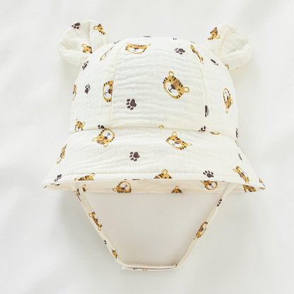 Chapeau de soleil Le Cocon d'Or pour bébé en coton blanc avec motif tigre et oreilles d'ours, style bob respirant.