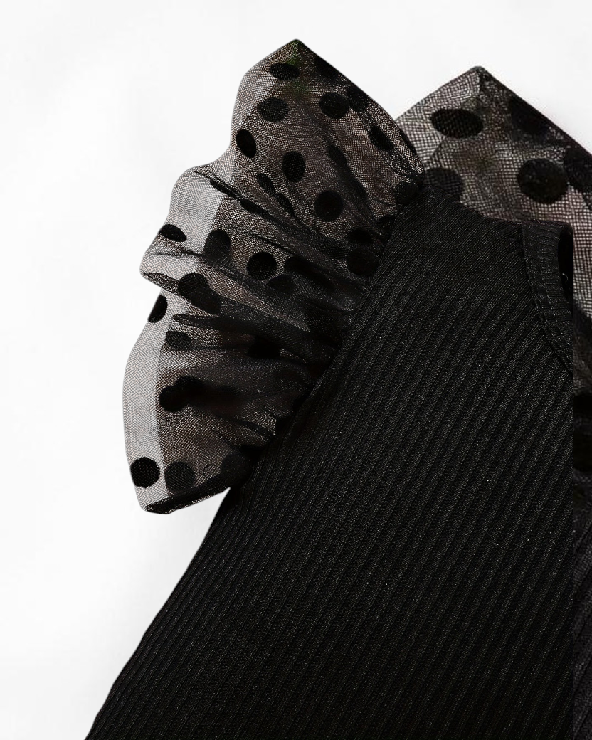 Combinaison Le Cocon d'Or pour bébé fille en maille noire avec manches à volants en tulle à pois