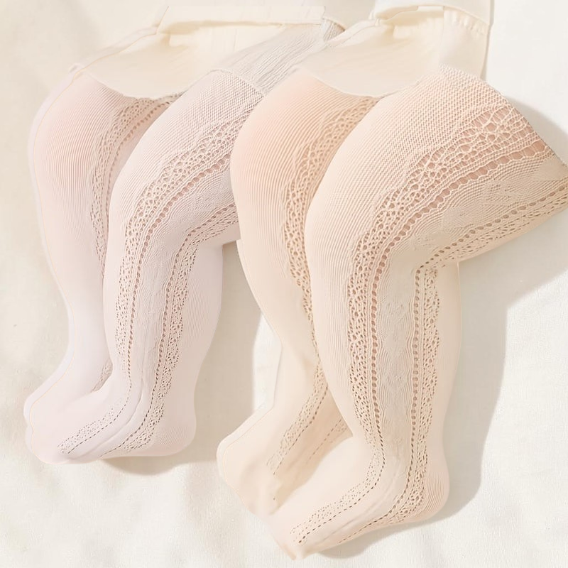 Collants Le Cocon d'Or pour fille en tricot respirant blanc et beige avec motif ajouré et découpe cœur sur le côté