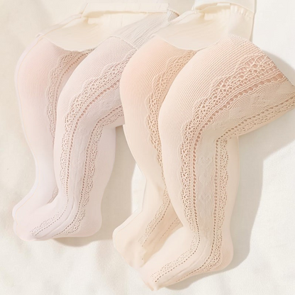 Collants Le Cocon d'Or pour fille en tricot respirant blanc et beige avec motif ajouré et découpe cœur sur le côté