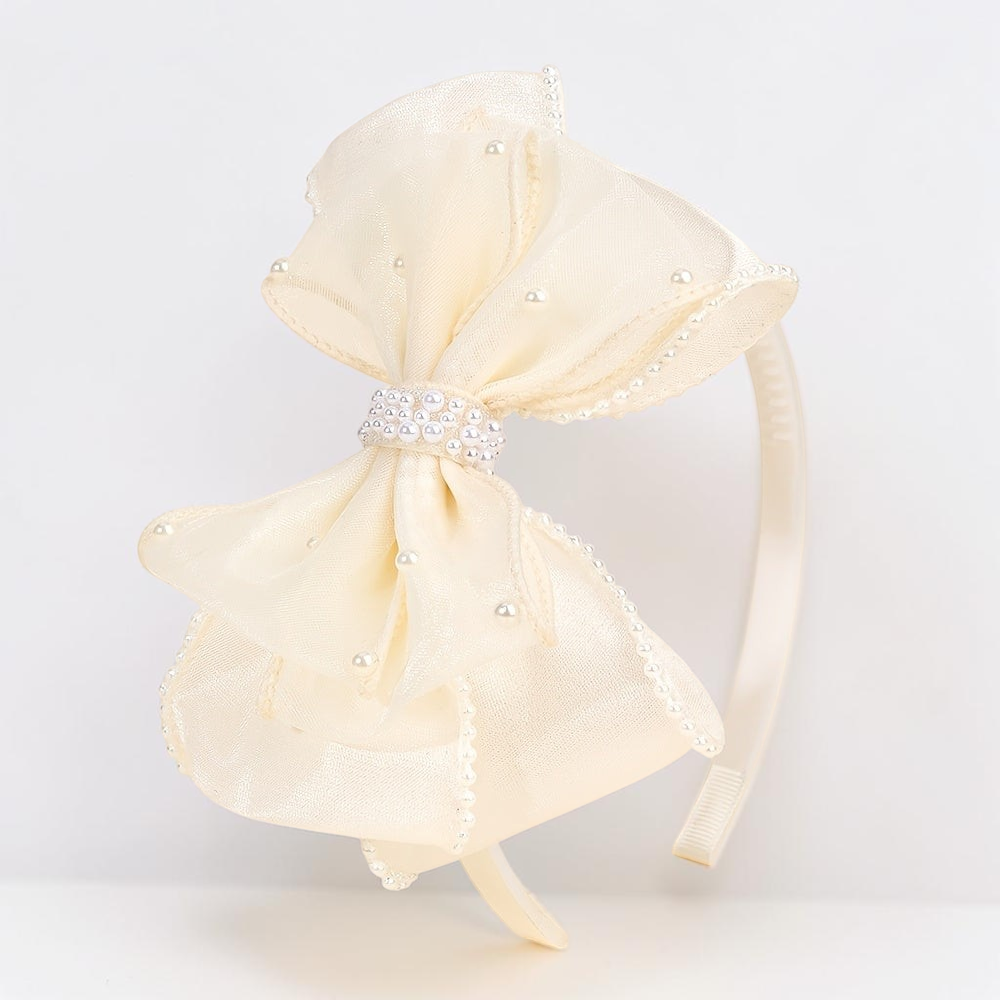 Serre-tête Le Cocon d'Or en tulle crème avec un grand nœud orné de perles, accessoire élégant pour fêtes