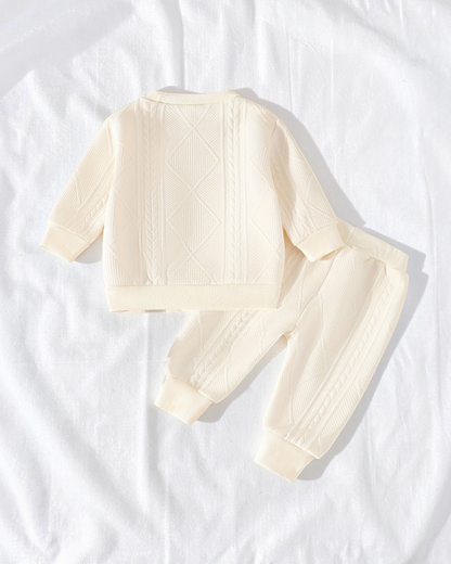 Ensemble Le Cocon d'Or pour bébé composé d'un haut à manches longues et d'un pantalon en maille crème texturée