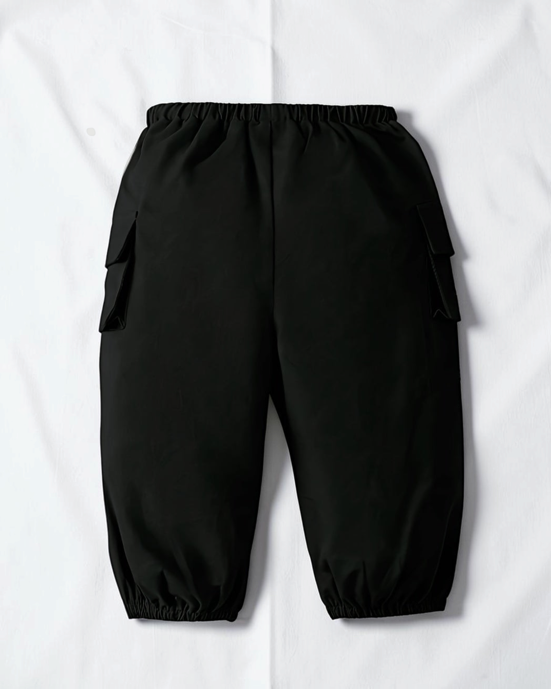 Pantalon cargo noir en coton pour fille Le Cocon d'Or avec poches latérales et chevilles élastiquées