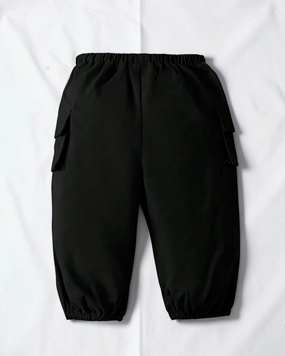 Pantalon cargo noir en coton pour fille Le Cocon d'Or avec poches latérales et chevilles élastiquées