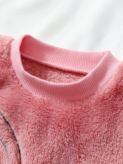 Col rond côtelé rose d'un pyjama en peluche Le Cocon d'Or pour enfant en polyester doux
