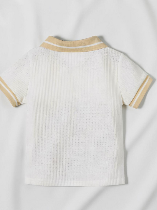 Polo bébé garçon Le Cocon d'Or blanc en maille texturée avec col et bords de manches contrastés beige
