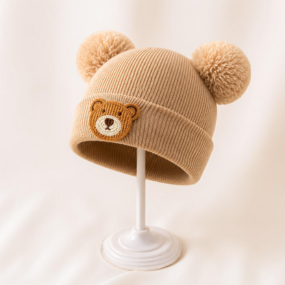 Bonnet bébé Le Cocon d'Or beige en maille acrylique avec motif ours et deux pompons, style hivernal mignon