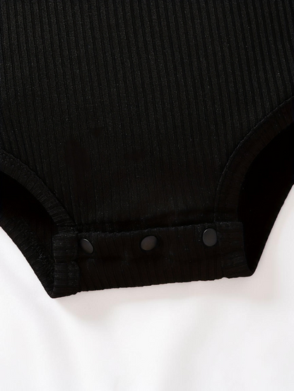 Body noir en maille côtelée pour bébé fille Le Cocon d'Or avec boutons-pression pratiques à l'entrejambe