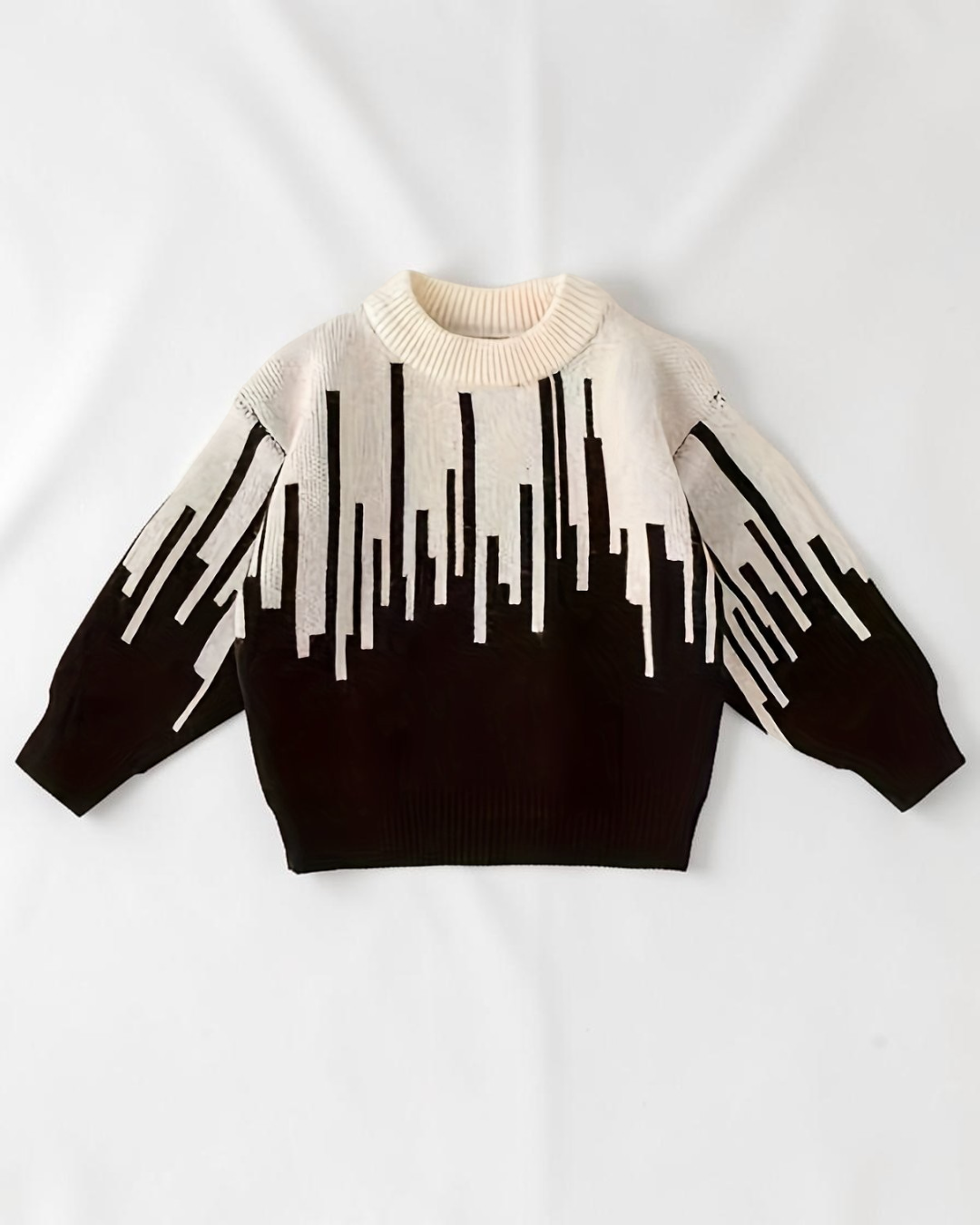 Pull en maille Le Cocon d'Or pour bébé garçon, noir et blanc avec motif abstrait, col rond et manches longues.