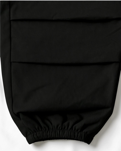 Pantalon décontracté noir en coton pour fille Le Cocon d'Or avec poignets élastiques et poches latérales
