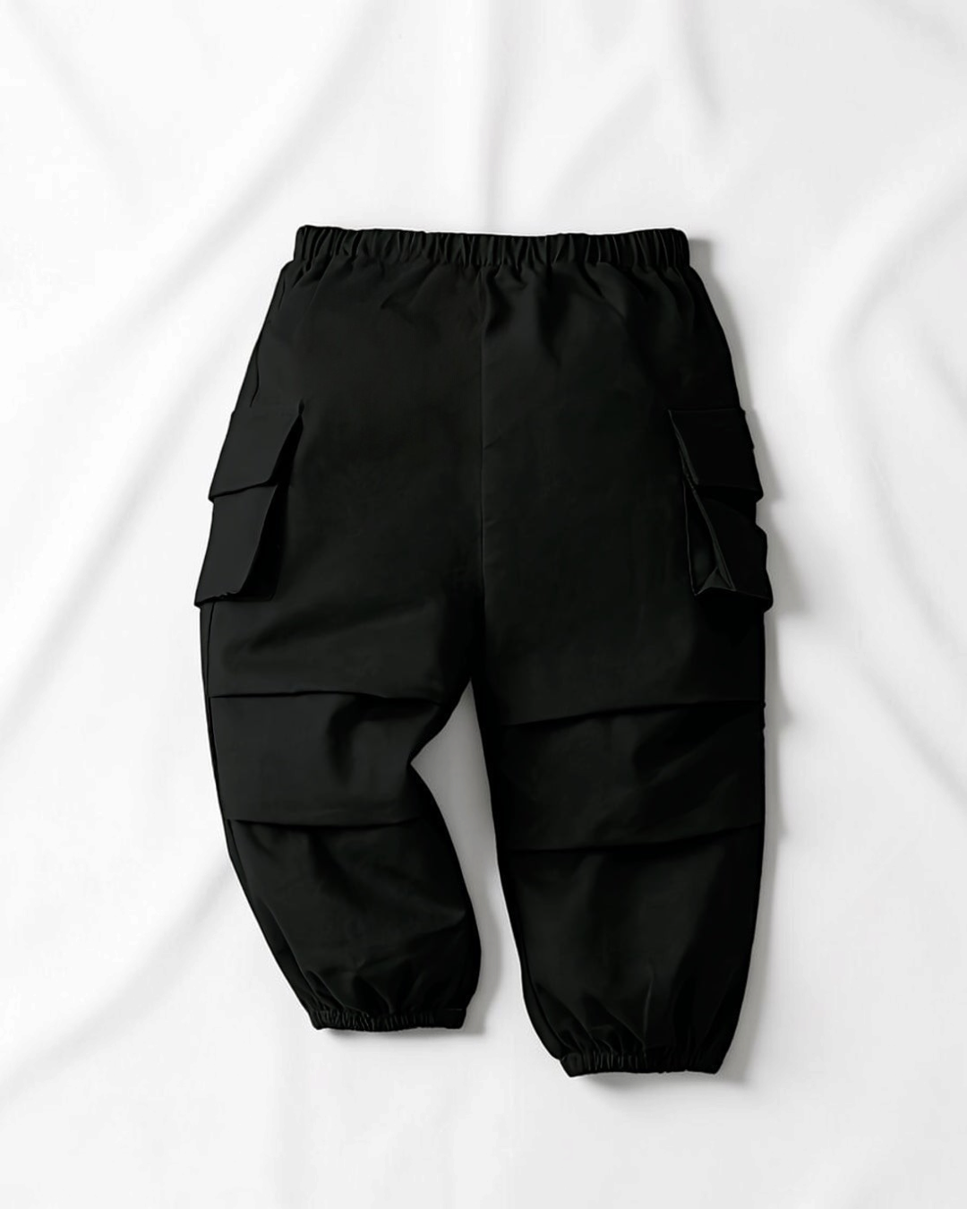 Pantalon cargo noir en coton pour fille Le Cocon d'Or avec poches latérales et chevilles élastiques