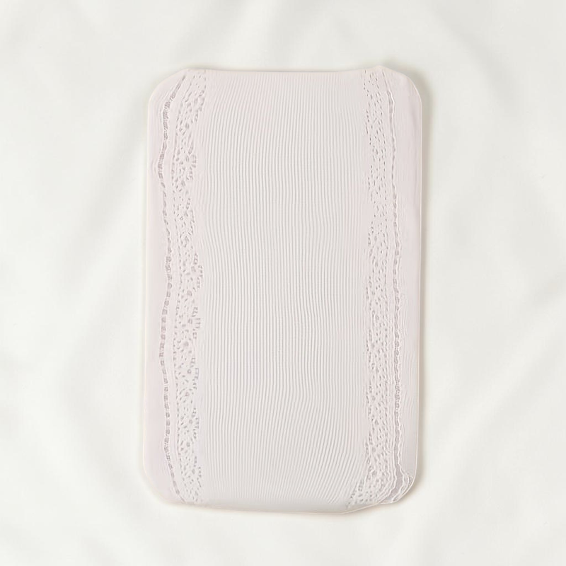 Collant Le Cocon d'Or pour fille en tricot blanc beige avec détails en dentelle et motif cœur sur le côté