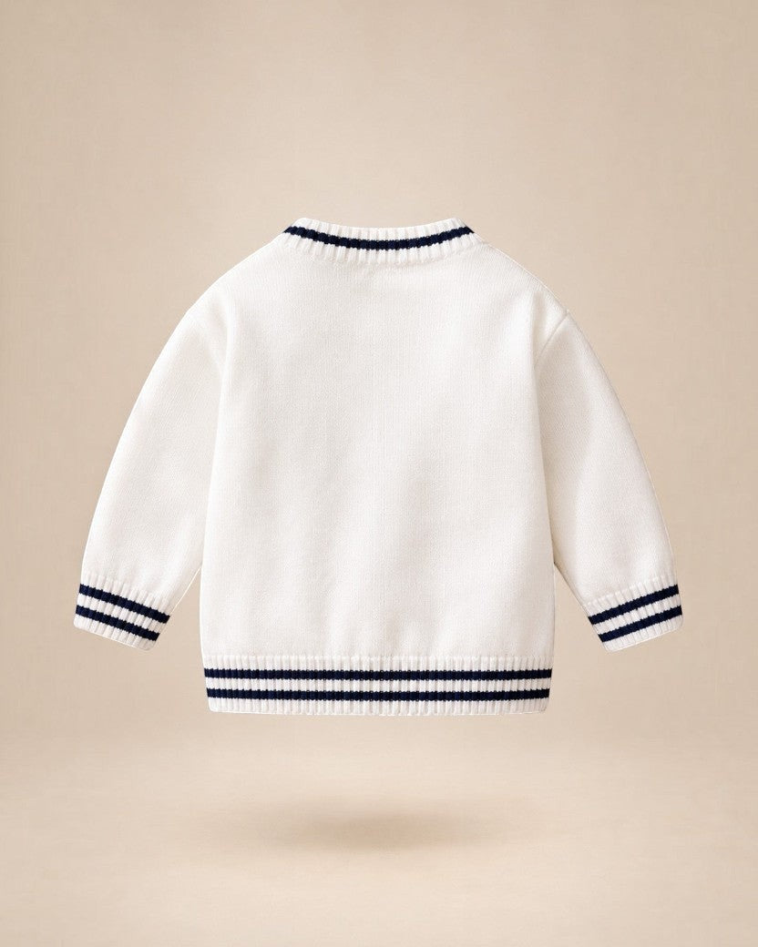 Cardigan en maille blanc Le Cocon d'Or pour bébé avec rayures contrastées bleu marine au col, aux poignets et à la base