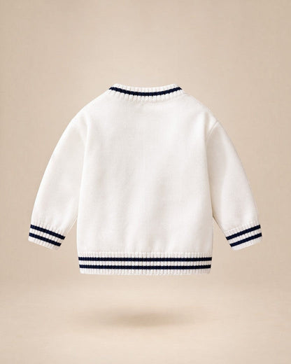 Cardigan en maille blanc Le Cocon d'Or pour bébé avec rayures contrastées bleu marine au col, aux poignets et à la base