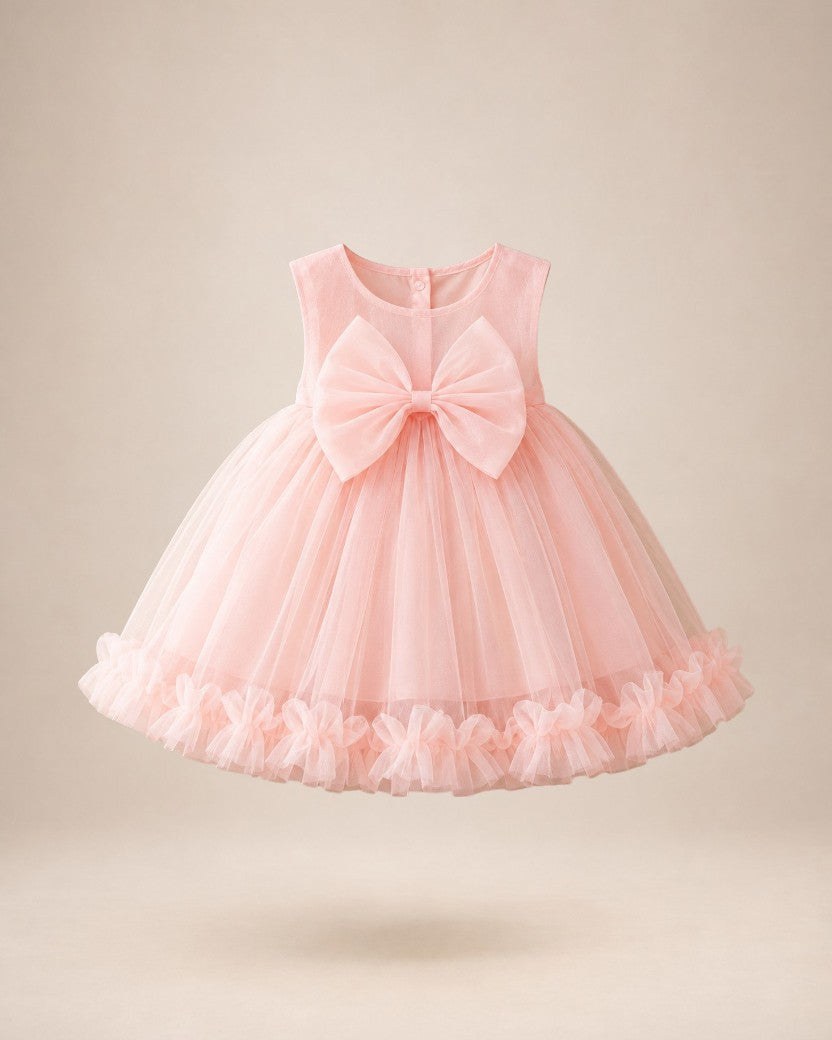 Robe de cérémonie Le Cocon d'Or pour bébé fille, rose pâle en tulle avec un grand nœud et jupe à volants