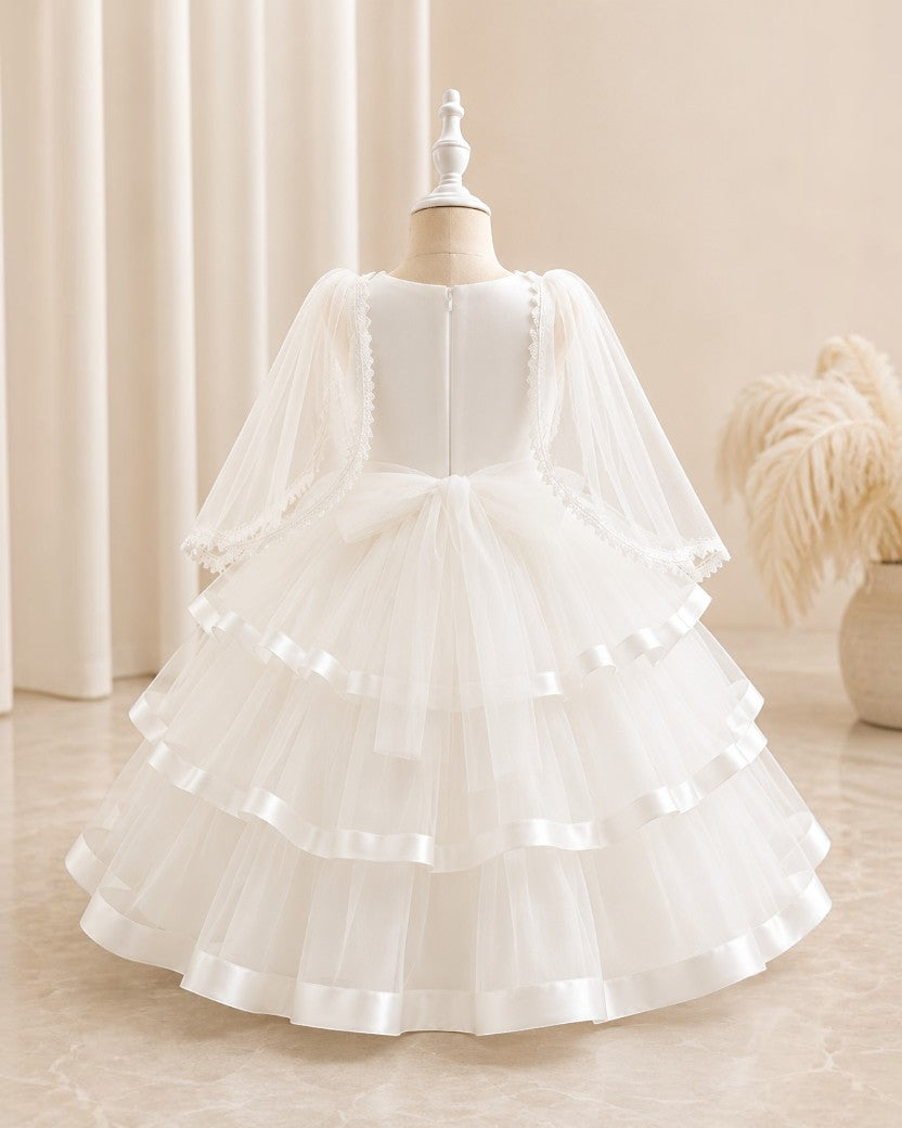 Robe midi blanche pour fille Le Cocon d'Or avec manches bouffantes en tulle, détails perlés et jupe évasée à volants.